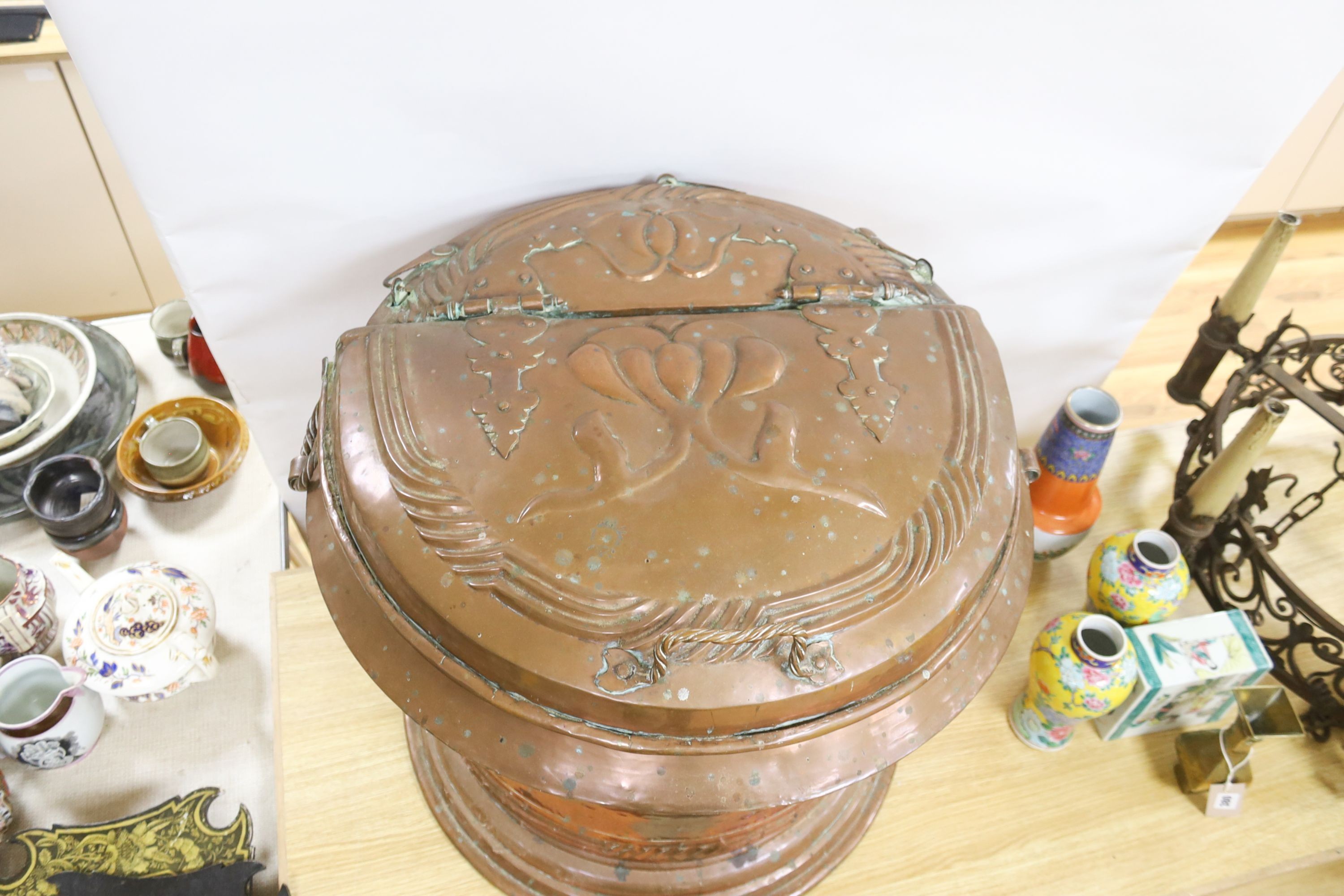 A large French provincial Art Nouveau copper lidded bin with handles 57cm